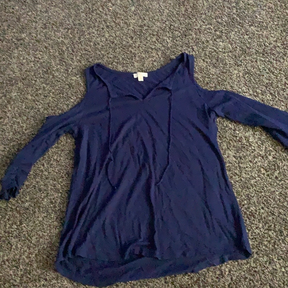 Navy shirt with cut outs at the shoulders.